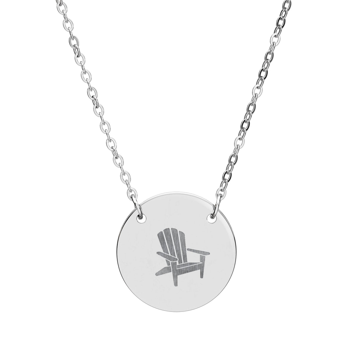 Après All Ways silver necklace with a round pendant engraved with an Adirondack chair, suspended from a delicate oval-link chain on a white background.