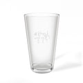 Back view of an Après All Ways pint glass featuring anchor, crossed skis, and golf tee icons representing sea, ski, and golf.